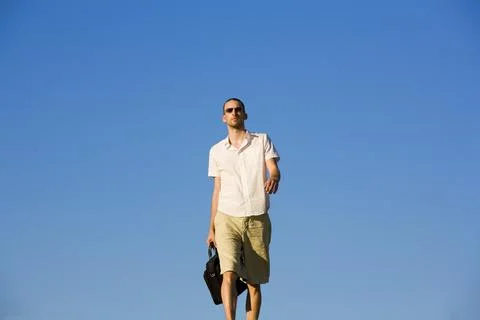 Man Walking With A Case Stock Photos