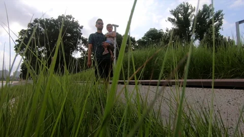 Man walking with child 库存影片 168374328