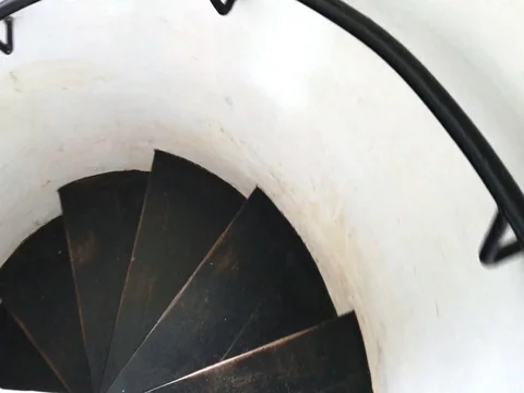 Man walking on circle stairs Stock Footage 76953595
