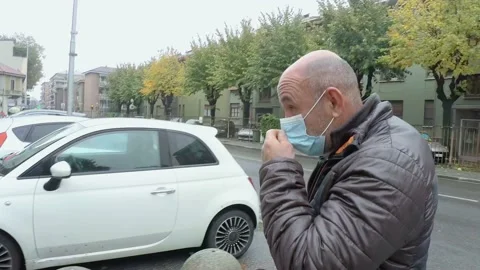 Man Walking in the City While Wears Medical Mask During Covid-19 Pandemic Stock Footage 141385964