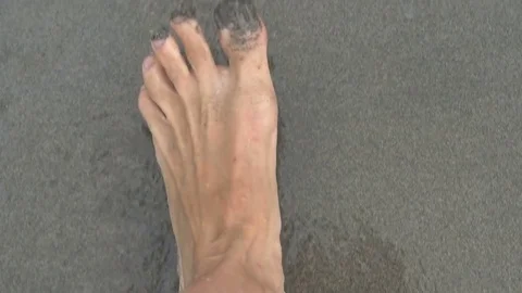 Man walking in the clear water with bubbles, steadycam shot, slow motion shot at Stock Footage 82453112