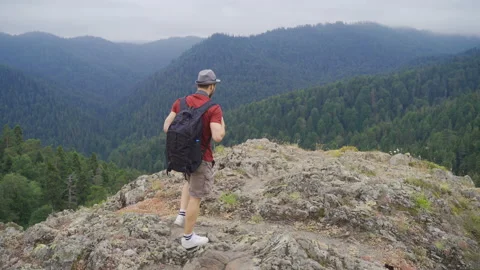 Man walking on cliffs. Stock-Footage 212256888