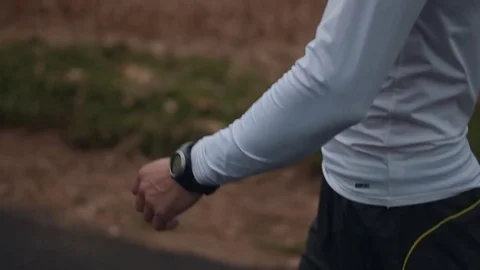 Man Walking by Cloudy Field After Running Stock Footage 81530050