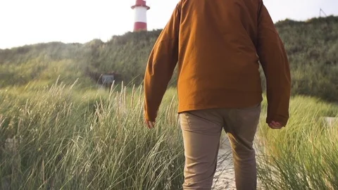 Man walking on coast in slow motion Stock-Footage 71565367