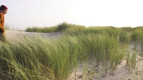 Man walking on coast in slow motion Stock-Footage 71565654