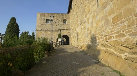 Man walking on a corridor under an arch at Forense Roman Basilica in Trieste Stock Footage 60246722