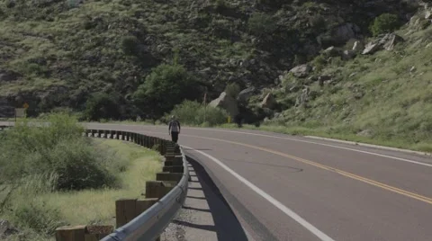Man Walking on a Country Road Stock Footage 46844702
