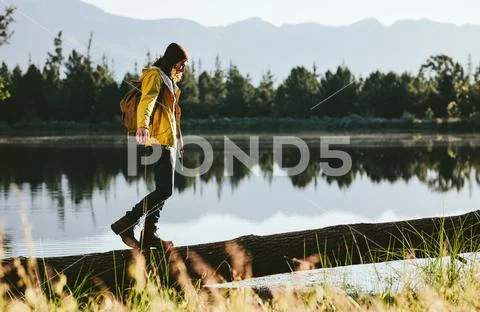Man walking in countryside exploring nature Stock Photos