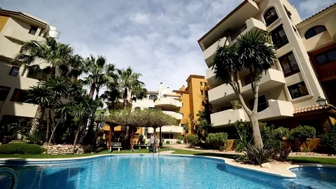 The man is walking in the courtyard of the hotel Video stock 75217090