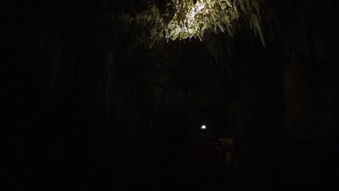 Man Walking In Dark Cave Stock Footage 75206916
