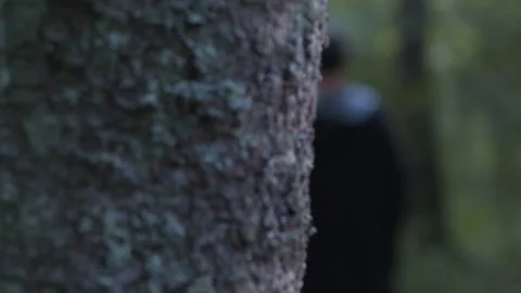 A man is walking in a dark forest Stock Footage 139637933