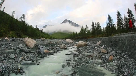 Man Walking in a Dark Misty Mountain Field Stock Footage 103854681