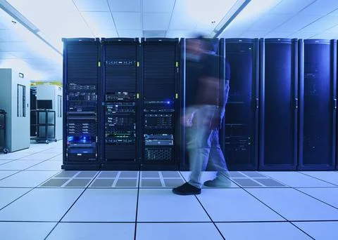 Man walking in data center Stock Photos