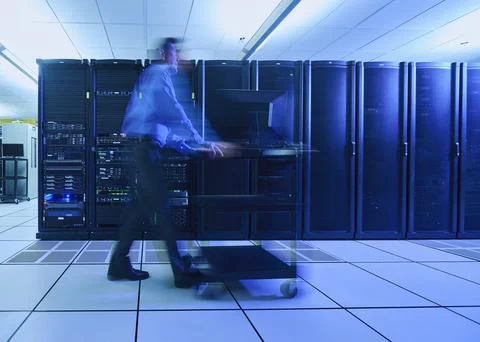 Man walking in data center Stock Photos