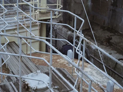 Man walking on the deck of an old ship in a port Stock Footage 71867586