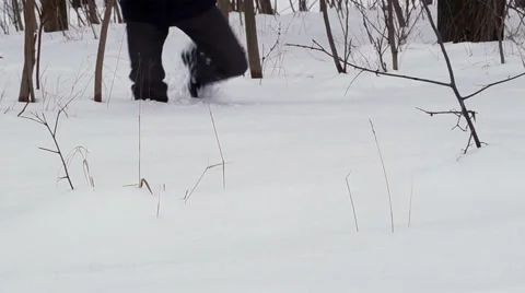 Man Walking in Deep Snow Stock Footage 45855806
