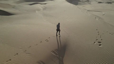 Man walking on desert in africa Stock Footage 263188538