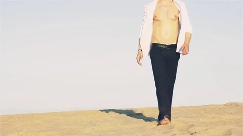 Man is walking in the desert Stock Footage 77210039