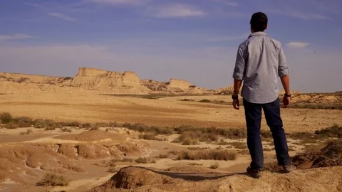 Man walking into the desert. Stock Footage