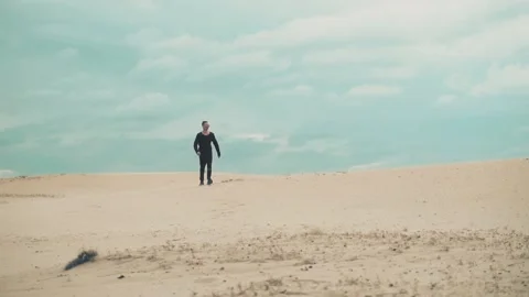 Man is walking in desert Stock Footage 89779641