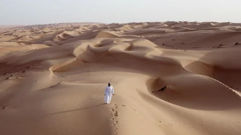 A man walking in the desert Stock Footage 202171478