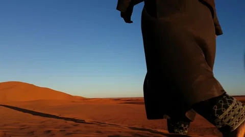 Man Walking In The Desert Sahara At Sunset (3) Stock Footage