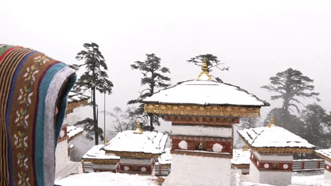 A man walking at the Dochula Pass, Druk Wangyal Chortens in Bhutan Stock-Footage 220457371