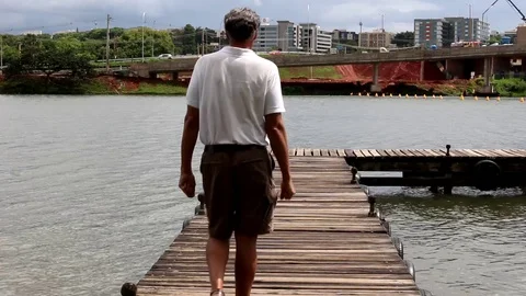 Man Walking on Dock Video stock 120881553