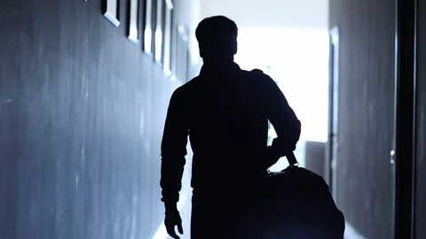 Man walking down the haiiway 4 Stock Footage 309554293