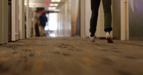 Man Walking Down Hallway of Tech Business Stock Footage 79438404