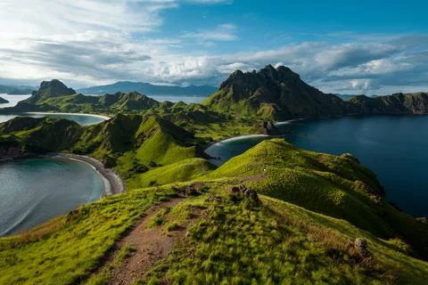 A man walking down the hill of Padar island Stock Photos