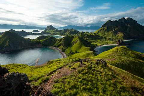 A man walking down the hill of Padar island Stock Photos