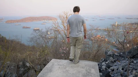 Man Walking Down Long Stairway From Island Hill Top Stock Footage 126579550