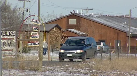 Man Walking Down Road on Fort Belknap Indian Reservation Stock Footage 104969265