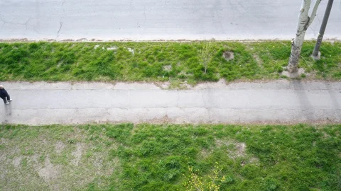 A man walking down the road, a view from above. Video stock 127354160