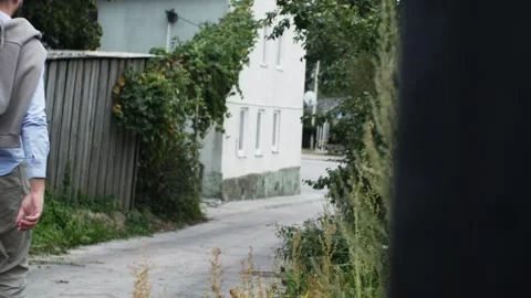 A man is walking down the road. A walk around the city. sightseeing. Stock Footage 283924218