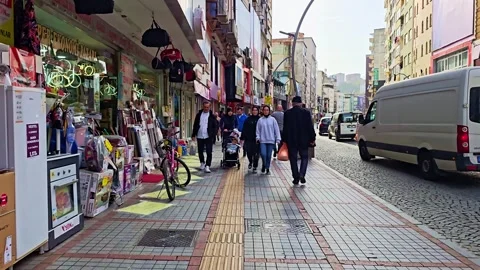 A man walking down a sidewalk with a bunch of luggage Stock Footage 272911649