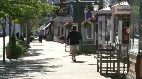 Man walking down sidewalk Stock Footage 10685352
