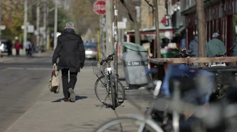 Man walking down sidewalk Stock Footage 34028295