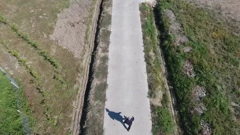 A man walking down a sidewalk Stock Footage 130828853