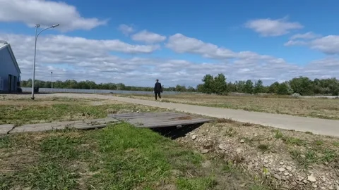 A man walking down a sidewalk Stock Footage 130829262