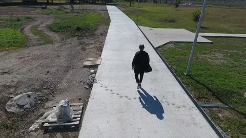 A man walking down a sidewalk Stock-Footage 130830223