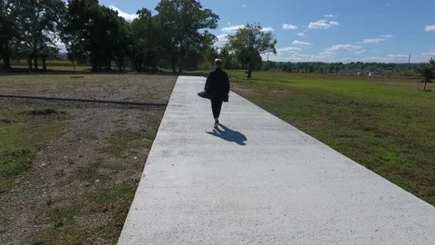 A man walking down a sidewalk Stock-Footage 130830257