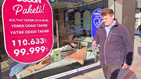 A man walking down a sidewalk past a store Video stock 272866649