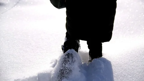 Man walking down the snow Stock Footage 129421909