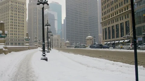 Man walking down snowy Michigan Avenue in Downtown Chicago Stock Footage 86527922