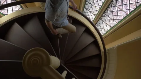 Man Walking Down Spiral Staircase Stock Video Pond5
