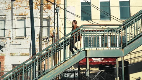 Man Walking Down Stairs Alone Stock Footage 154561374