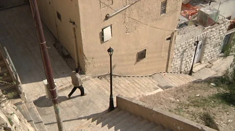 Man walking down the stairs Amman city Stock Footage 58494743