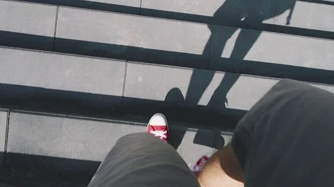 Man walking down the stairs, slow motion Stock Footage 80514483